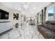 Spacious living room with modern furnishings, marble floors, and plenty of natural light at 942 S County Road 129 Rd, Bennett, CO 80102