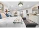 Spacious main bedroom with wood flooring, a decorative chandelier, and ample natural light at 942 S County Road 129 Rd, Bennett, CO 80102