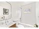 Bright bathroom features a bathtub with white subway tiles and modern fixtures at 133 S Xavier St, Denver, CO 80219