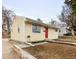 Well-maintained single-story home featuring a bright red door and tidy landscaping; an inviting space at 133 S Xavier St, Denver, CO 80219