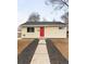 Charming single-story home featuring a bright red door, manicured front yard, and welcoming curb appeal at 133 S Xavier St, Denver, CO 80219