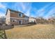 Expansive backyard featuring a circular patio, offering ample space for outdoor enjoyment at 14881 E 117Th Ave, Commerce City, CO 80603