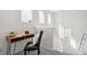 Home office nook with wood desk, natural light, and neutral carpet at 14881 E 117Th Ave, Commerce City, CO 80603