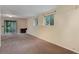 Spacious finished basement features an efficient fireplace and a sliding glass door to the outside at 9209 William Cody Dr, Evergreen, CO 80439