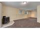 Finished basement with carpet, fireplace and natural light; ideal for entertaining and relaxation at 9209 William Cody Dr, Evergreen, CO 80439