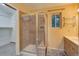 Bathroom featuring a glass enclosed shower with tiled walls, and a vanity with cabinets at 9209 William Cody Dr, Evergreen, CO 80439