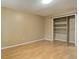 Bedroom features laminate floors, light walls, and large closet at 9209 William Cody Dr, Evergreen, CO 80439