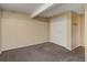 This bedroom features neutral decor and carpet, with closet for easy storage at 9209 William Cody Dr, Evergreen, CO 80439