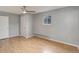 Spacious bedroom with hardwood floors, large window, and ample closet space at 9209 William Cody Dr, Evergreen, CO 80439