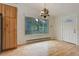 Bright dining area features hardwood floors and a window overlooking the outdoors at 9209 William Cody Dr, Evergreen, CO 80439
