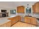 Kitchen featuring wood cabinets, stainless steel appliances, and gray countertops at 9209 William Cody Dr, Evergreen, CO 80439