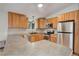 Kitchen featuring wood cabinets, stainless steel appliances, and gray countertops at 9209 William Cody Dr, Evergreen, CO 80439