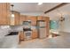 Kitchen with wooden cabinets, gray countertops, and stainless steel appliances at 9209 William Cody Dr, Evergreen, CO 80439