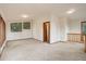 Bright living room offers an open layout with plenty of natural light from multiple windows at 9209 William Cody Dr, Evergreen, CO 80439