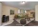 Cozy staged living room with stylish furniture, decorative art, and a warm, inviting atmosphere at 9209 William Cody Dr, Evergreen, CO 80439