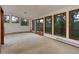 Spacious living room filled with natural light offers scenic wooded views at 9209 William Cody Dr, Evergreen, CO 80439
