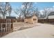 Backyard showing concrete patio, detached garage, rock garden, and the lawn at 1038 9Th Ave, Longmont, CO 80501