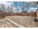 Backyard with detached garage, rock garden, lawn, and wooden fence at 1038 9Th Ave, Longmont, CO 80501