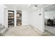 Unfinished basement area with shelving and a doorway to another part of the basement at 1038 9Th Ave, Longmont, CO 80501