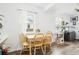 Inviting dining area featuring light wood furniture and ample natural light at 1038 9Th Ave, Longmont, CO 80501