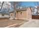 Side view of cozy home with a tidy yard and driveway at 1038 9Th Ave, Longmont, CO 80501