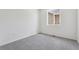 Spacious bedroom with new carpet, electrical outlets, and ample natural light at 19040 E 96Th Pl, Commerce City, CO 80022
