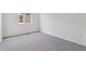Cozy bedroom with plush carpeting, offering comfort and style for relaxation at 19040 E 96Th Pl, Commerce City, CO 80022