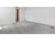 Spacious bedroom with new carpet, electrical outlets, and ample natural light at 19040 E 96Th Pl, Commerce City, CO 80022