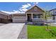 Charming single-Gathering home with a well-manicured lawn and inviting front porch at 19040 E 96Th Pl, Commerce City, CO 80022