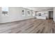 Bright living room with hardwood floors and an open concept kitchen, perfect for entertaining at 19040 E 96Th Pl, Commerce City, CO 80022
