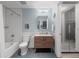 Clean bathroom with a bathtub, white subway tiles, and a wooden vanity with contemporary fixtures at 891 14Th St # 2505, Denver, CO 80202