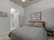 Comfortable bedroom with a cozy bed, soft lighting, and a view into an ensuite bathroom at 891 14Th St # 2505, Denver, CO 80202