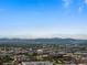 Panoramic city view with snow-capped mountains in the background, showcasing the urban landscape at 891 14Th St # 2505, Denver, CO 80202