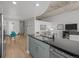 Bright kitchen with stainless steel appliances and granite countertops, open to dining and living areas at 891 14Th St # 2505, Denver, CO 80202