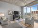 Cozy living room with a modern fireplace and city views at 891 14Th St # 2505, Denver, CO 80202