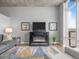 Comfortable living room featuring a fireplace and floor-to-ceiling windows at 891 14Th St # 2505, Denver, CO 80202
