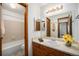 Bathroom with a vanity, tile flooring, and shower-tub combination at 8025 W Eastman Pl # 2-102, Lakewood, CO 80227