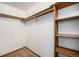 Functional bedroom closet with built-in shelves and hanging rods at 8025 W Eastman Pl # 2-102, Lakewood, CO 80227