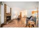 Bright living room with a fireplace, wood floors, and open layout at 8025 W Eastman Pl # 2-102, Lakewood, CO 80227