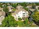 An eye-level view shows the deck of the two-story home with beautiful landscaping and a well-maintained yard at 9556 Kemper Dr, Lone Tree, CO 80124