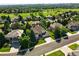 A beautiful aerial view of a home with a well-manicured lawn near a lush golf course and neighborhood at 9556 Kemper Dr, Lone Tree, CO 80124