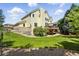 Inviting backyard with lush lawn, a deck perfect for outdoor entertaining, and mature landscaping at 9556 Kemper Dr, Lone Tree, CO 80124