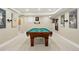 Basement game room with a billiards table and neutral carpeting at 9556 Kemper Dr, Lone Tree, CO 80124
