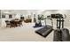Finished basement featuring a home gym, game tables, and living area at 9556 Kemper Dr, Lone Tree, CO 80124