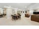 Basement living area with ample space for entertaining, including billiard room and TV at 9556 Kemper Dr, Lone Tree, CO 80124