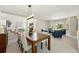 The dining room offers a view of the entry, great lighting, and cozy seating, creating an inviting and spacious area at 9556 Kemper Dr, Lone Tree, CO 80124