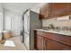 Laundry room with stainless steel appliances, sink, and cabinet space at 9556 Kemper Dr, Lone Tree, CO 80124