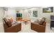 Cozy living room featuring comfortable couches and natural light at 9556 Kemper Dr, Lone Tree, CO 80124