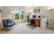 Bright home office with large windows, desk, and modern decor at 9556 Kemper Dr, Lone Tree, CO 80124