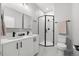 Stylish bathroom featuring a double vanity, and stand up shower with matte black fixtures at 3820 Jason St # 3, Denver, CO 80211